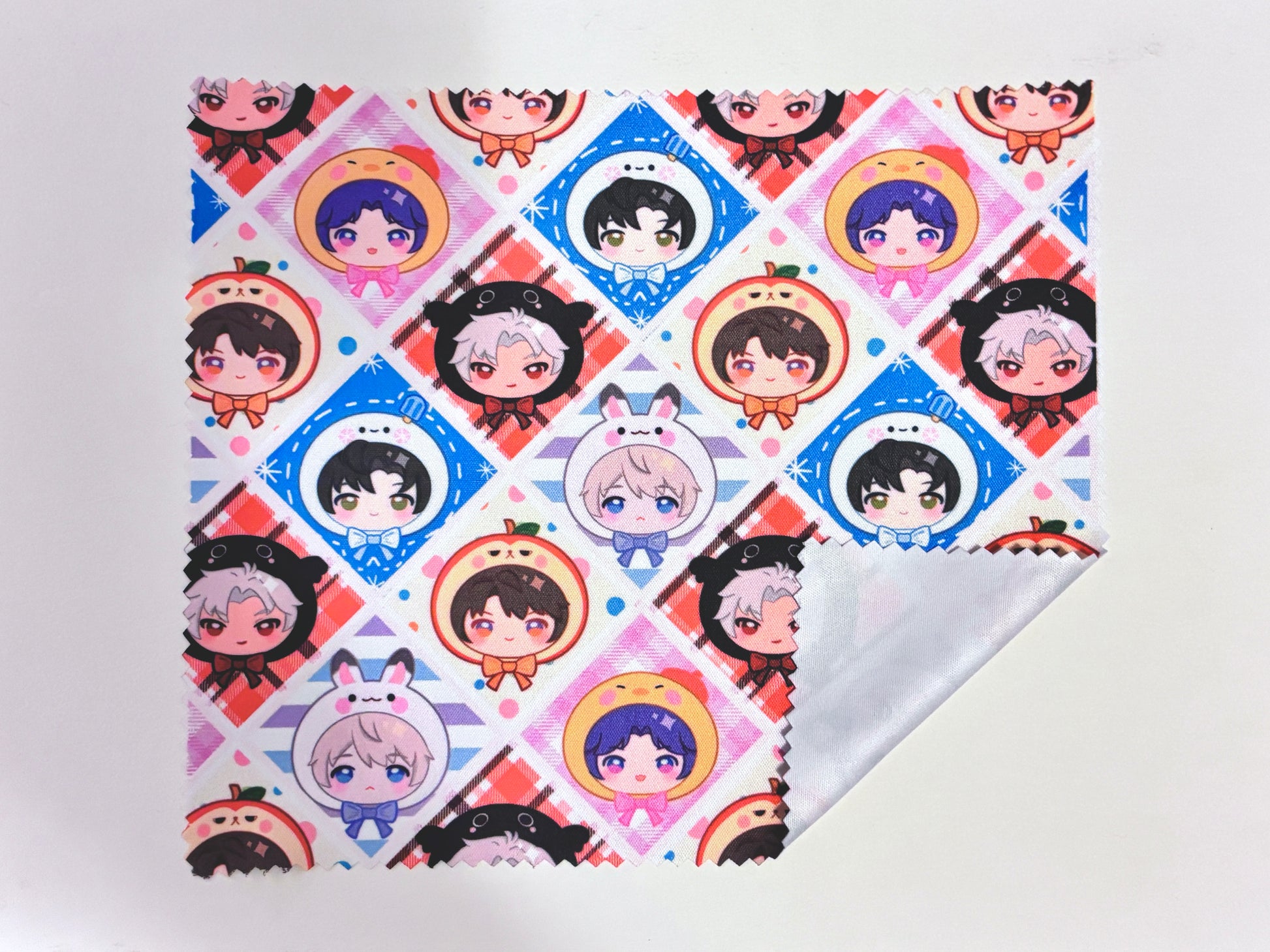 cleaning cloth with cartoon character designs on a multi-pattern background