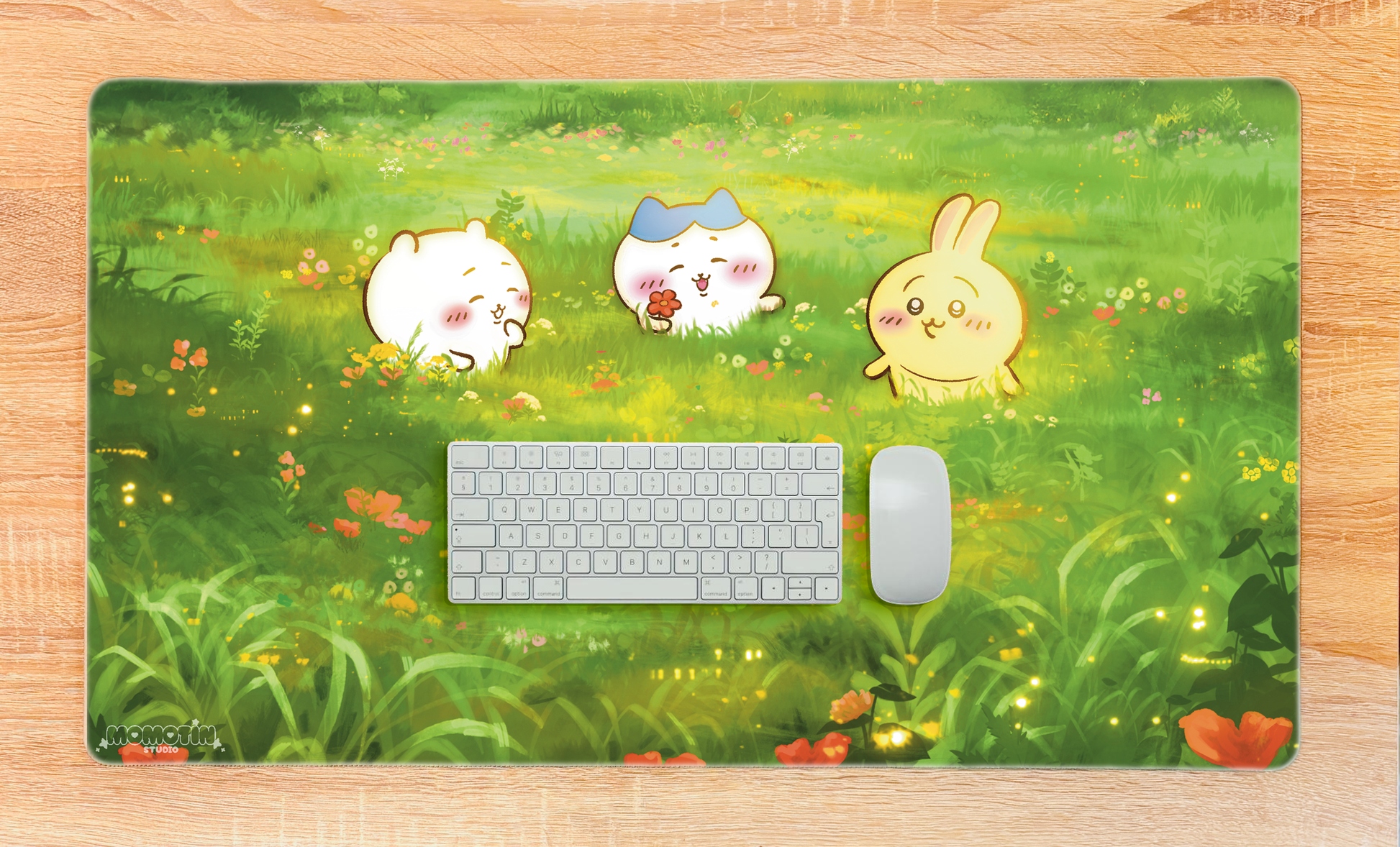 Keyboard and mouse on a grassy field desk mat with cartoon characters